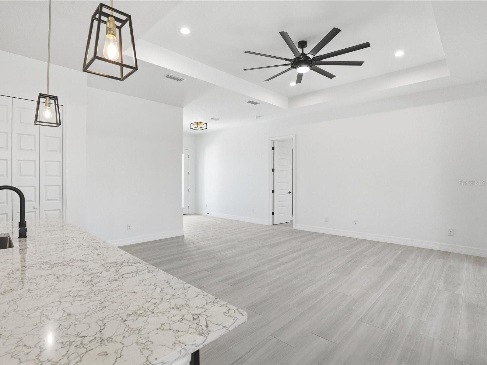 View of Living Room from Kitchen - 72 TEE VIEW RD, ROTONDA WEST