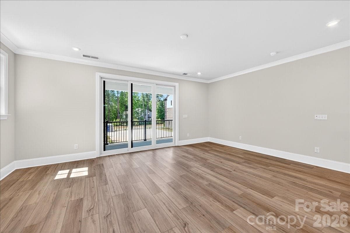 Light filled living room with access to the outdoor living - 12023 Elsa Lane, Charlotte