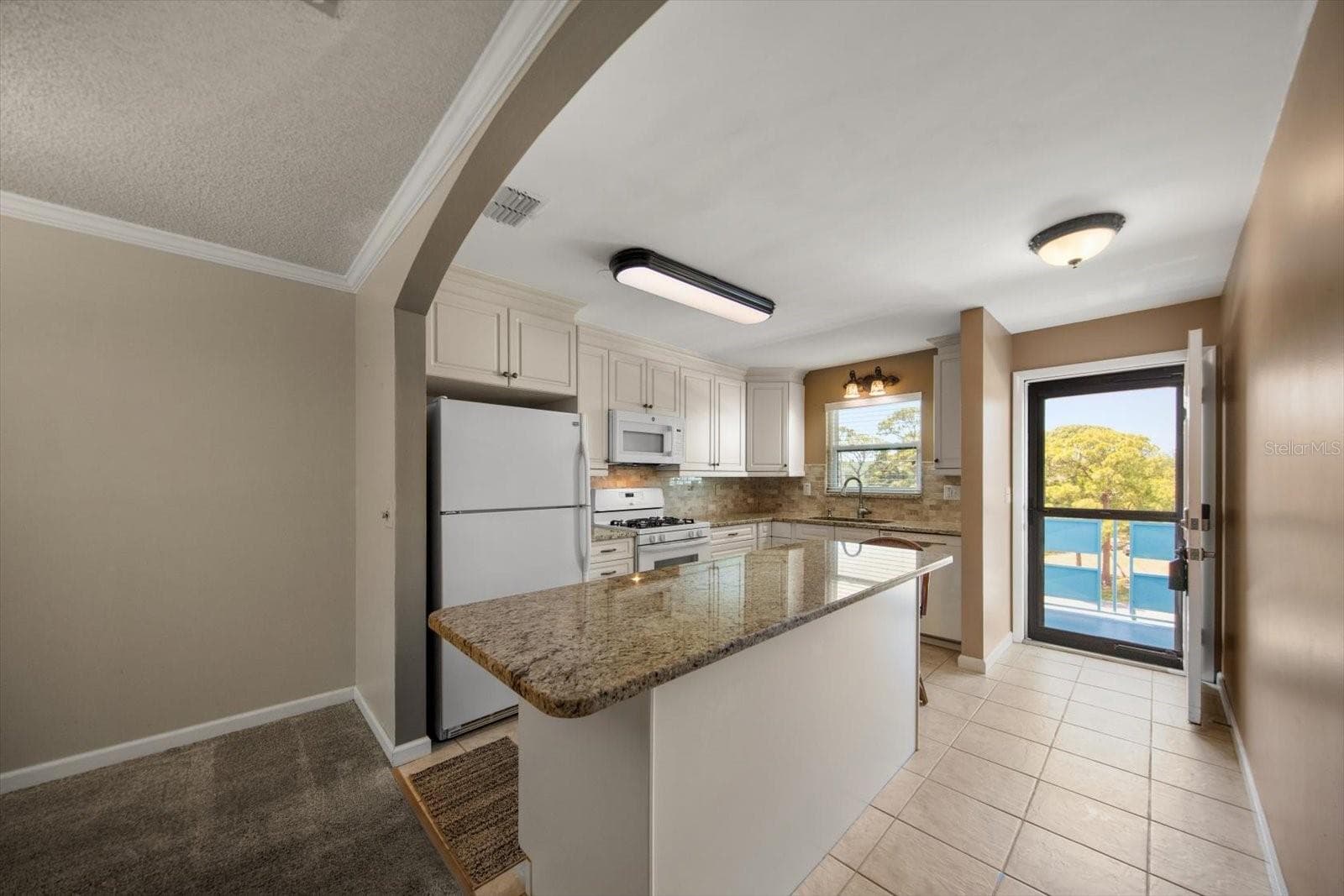 Gorgeous updated kitchen with lots of storage and new lighting - 5970 80TH ST N #411, ST PETERSBURG