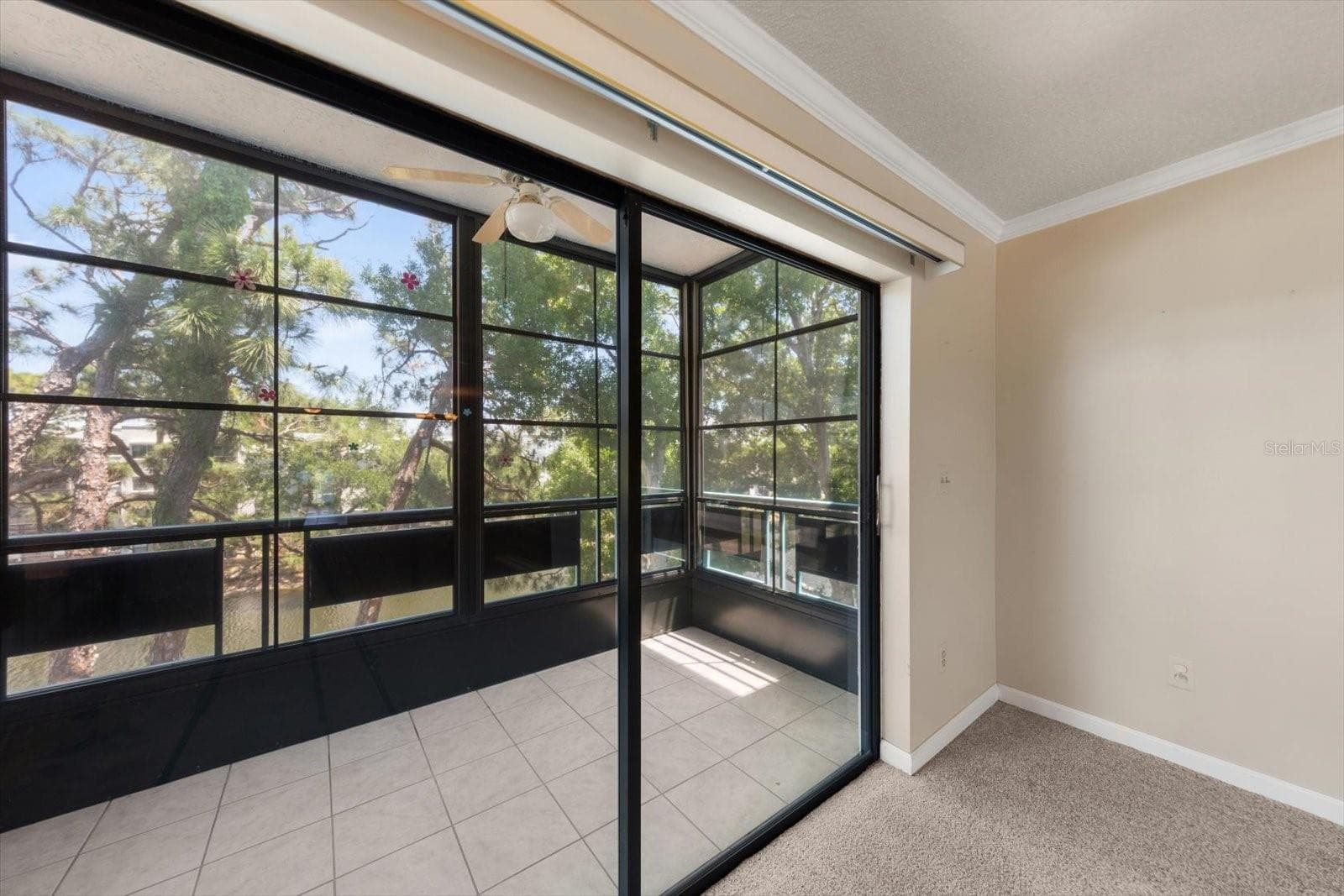 Fabulous enclosed porch that can have the panels removed to have just he screen. Great all weather porch overlooking the pond - 5970 80TH ST N #411, ST PETERSBURG