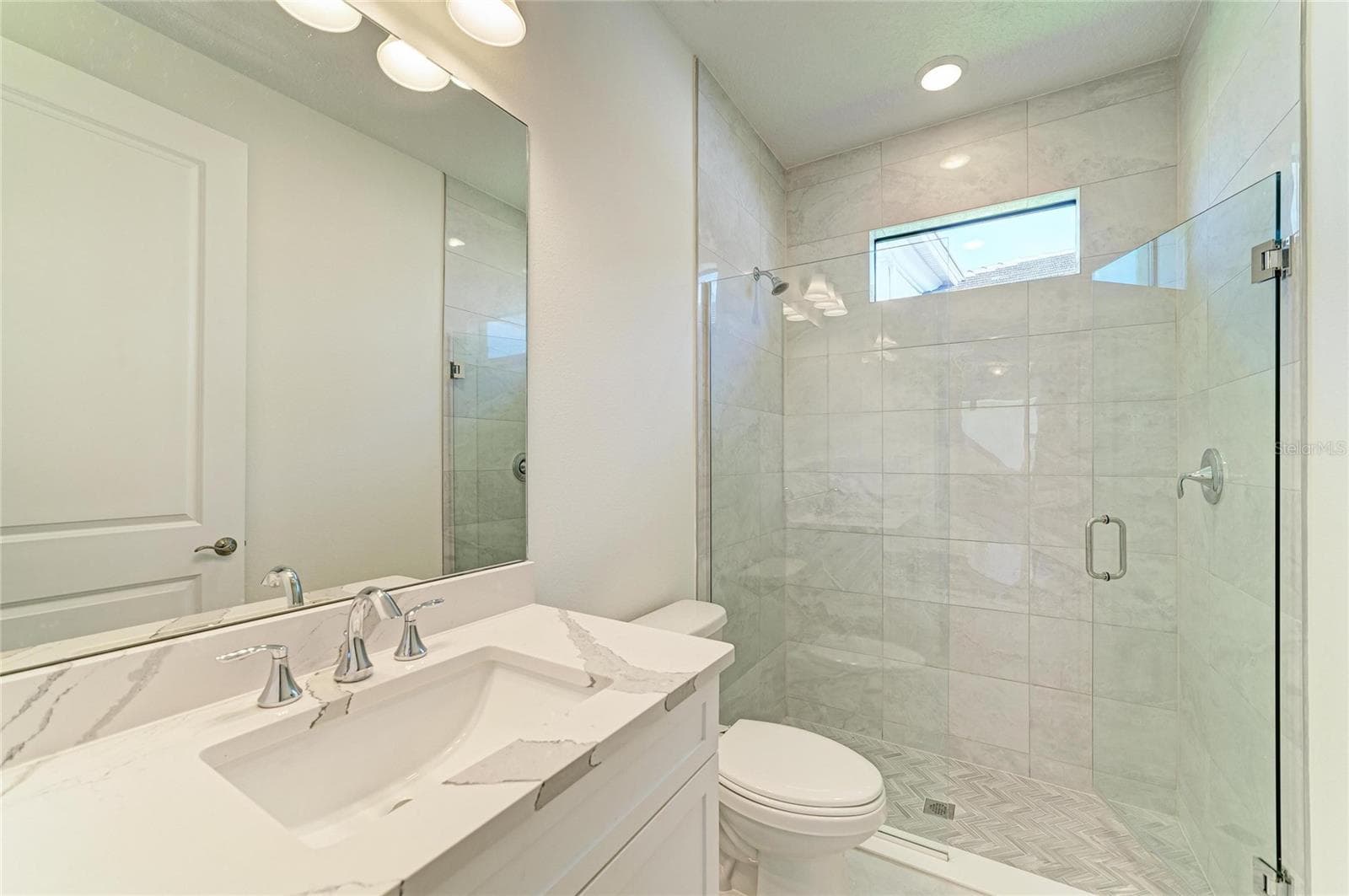 Secondary Bath upgraded tile and shower doors - 5290 BARNETT CIR, BRADENTON