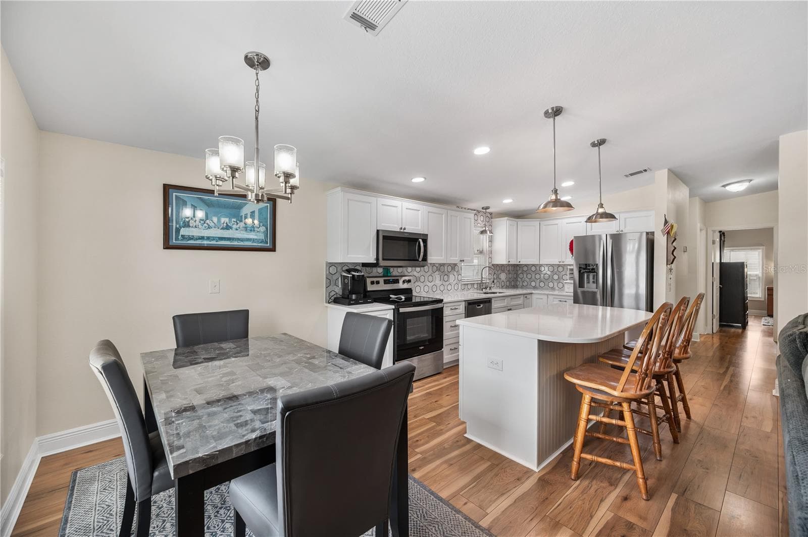 Dining room open to kitchen and living room - 1502 LONGBOW DR, LAKELAND