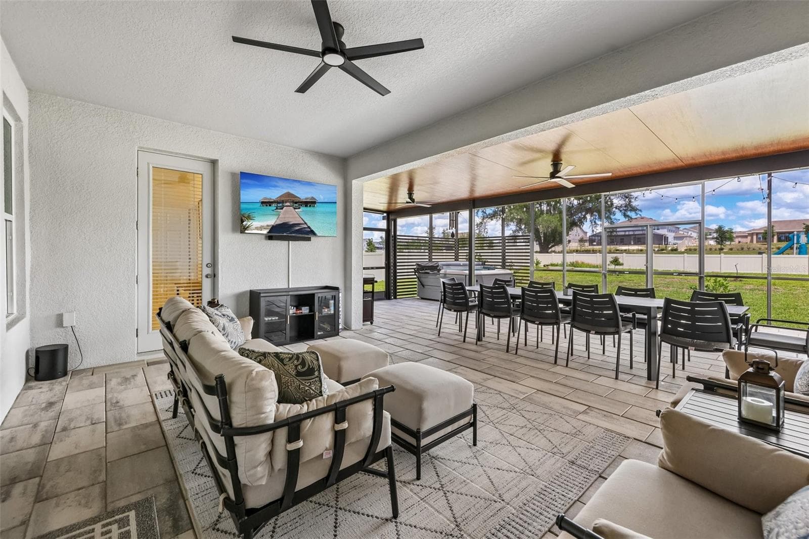 The covered lanai has been extended to create an outdoor oasis with multiple seating areas. - 6100 SIERRA CROWN ST, MOUNT DORA