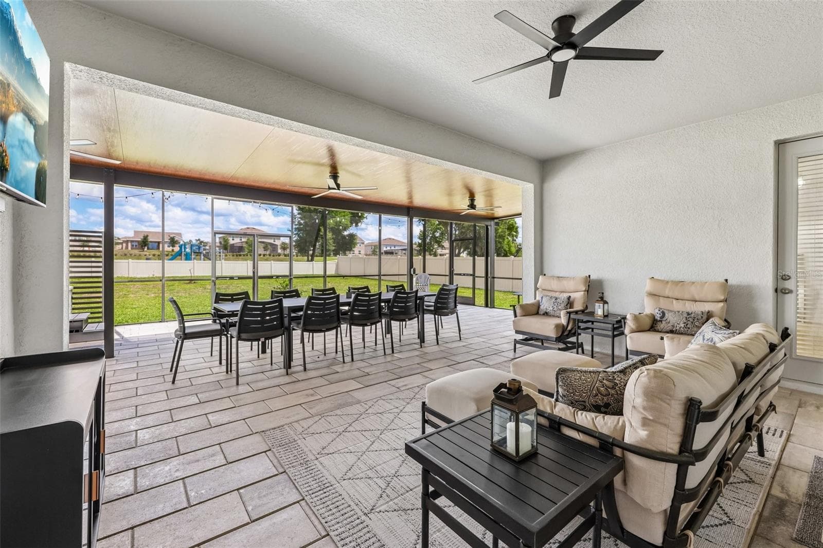 The covered lanai has been extended to create an outdoor oasis with multiple seating areas. - 6100 SIERRA CROWN ST, MOUNT DORA