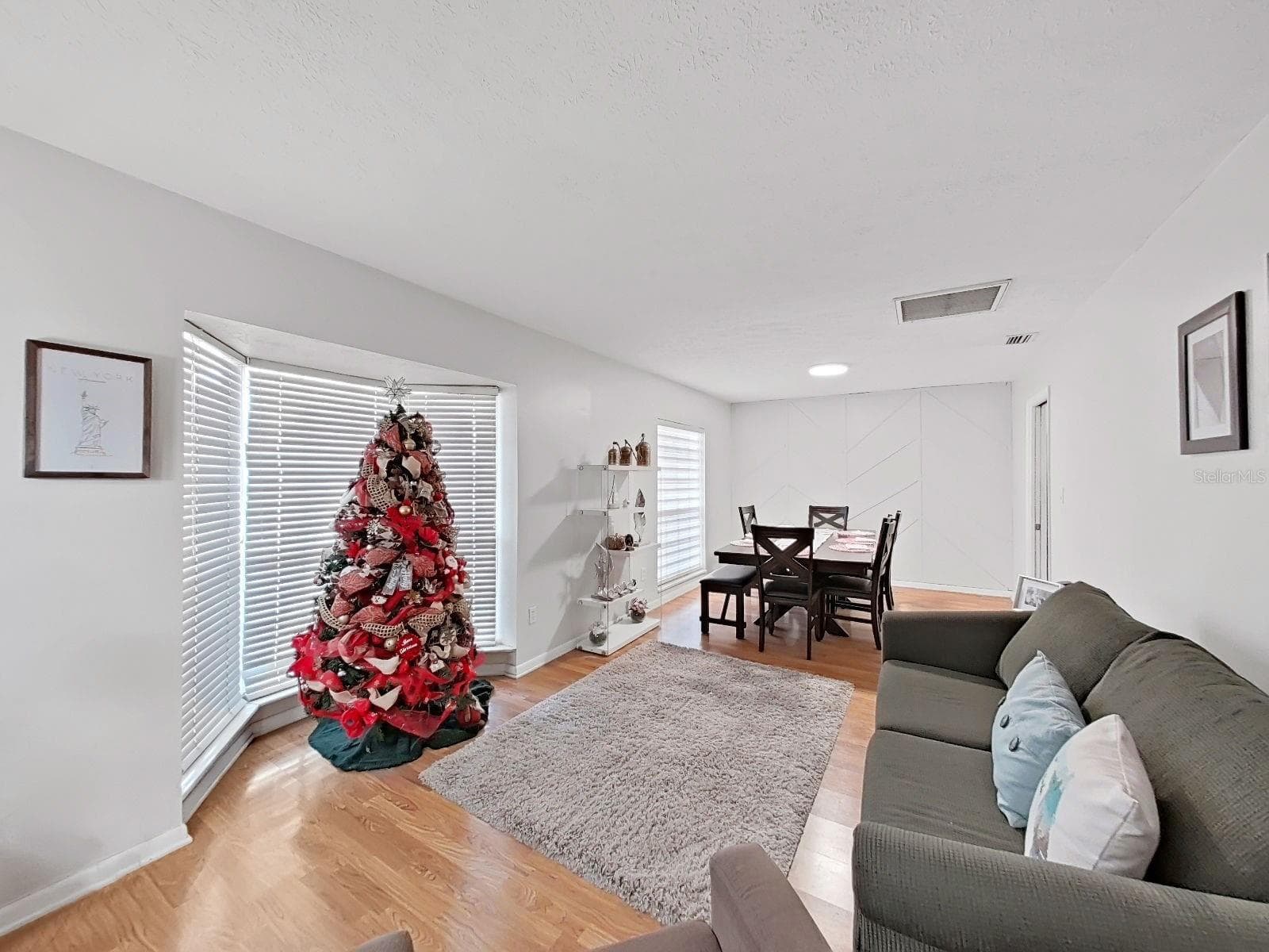 living room w bay window and dining room - 7608 BARRY RD, TAMPA