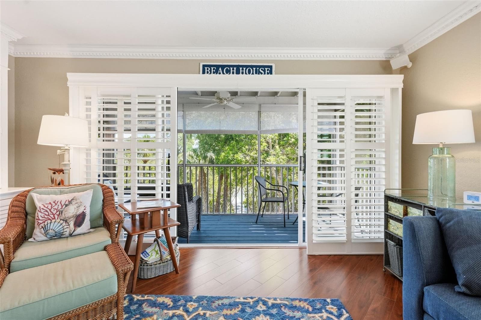 Sliding Plantation Doors to the screened patio overlooking a tranquil green space and the water. - 14837 SEMINOLE TRL, SEMINOLE