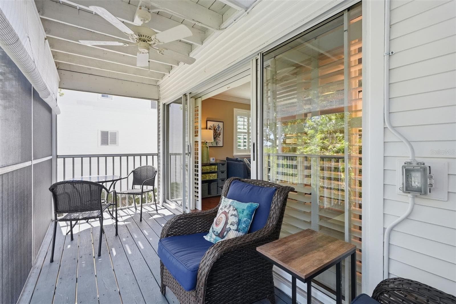 Screened Patio with ceiling fan overlooking the water. - 14837 SEMINOLE TRL, SEMINOLE