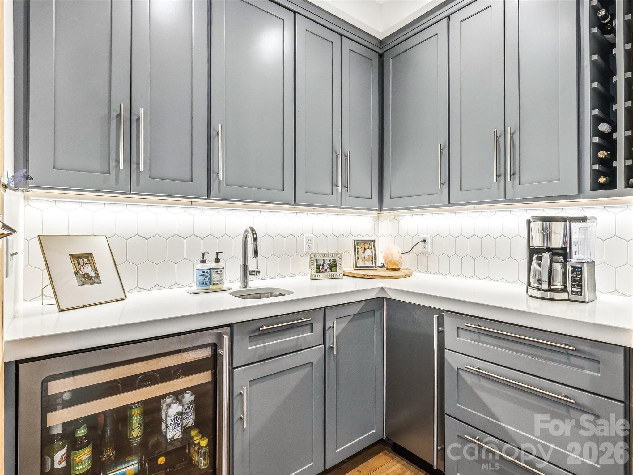 Custom built cabinetry in the wet bar complete with wine refrigerator and ice maker. - 10 Kalimar Heights, Hendersonville