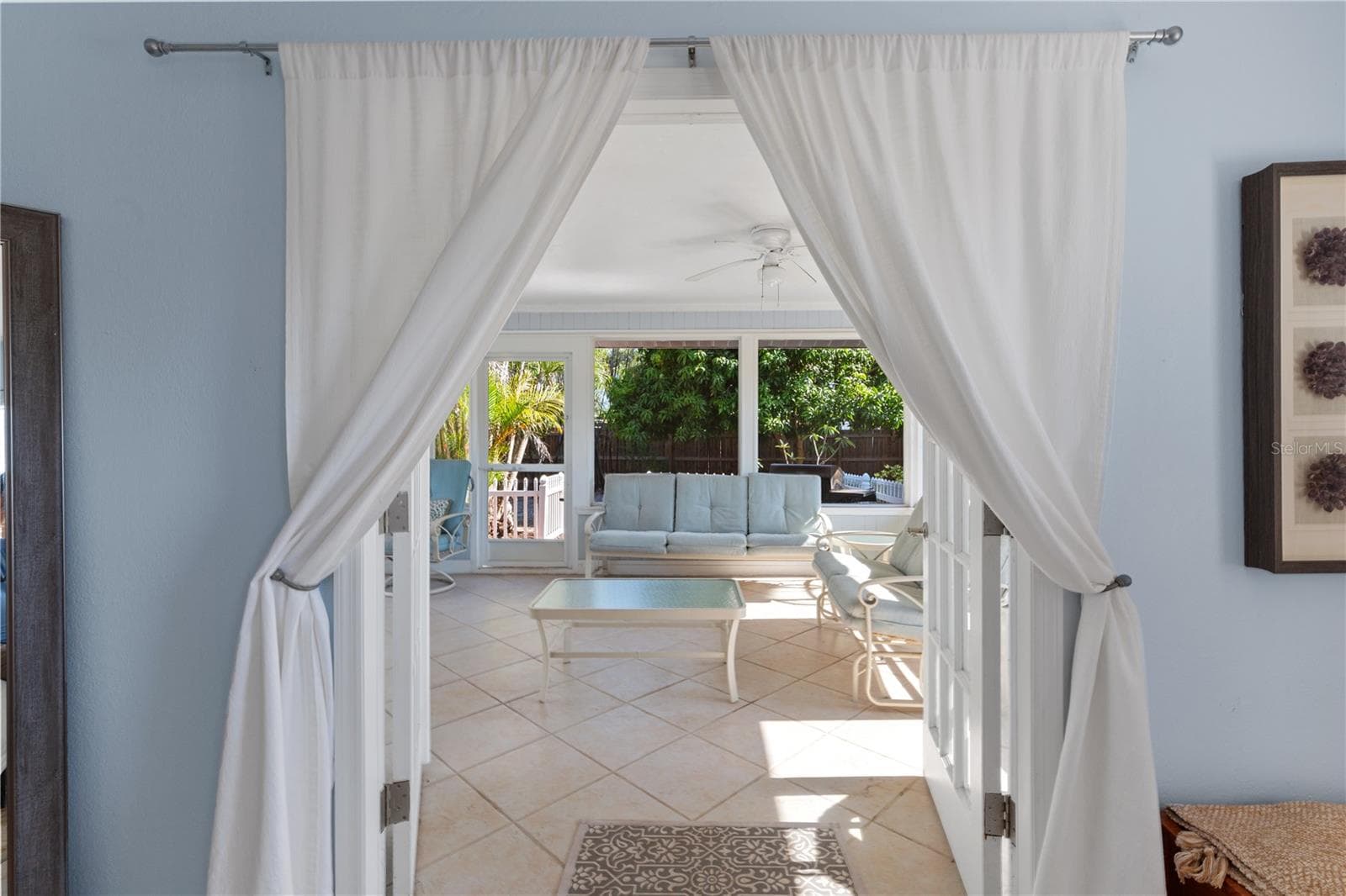 Primary Bedroom French doors to pool and patio - 7860 HOLIDAY DR, SARASOTA
