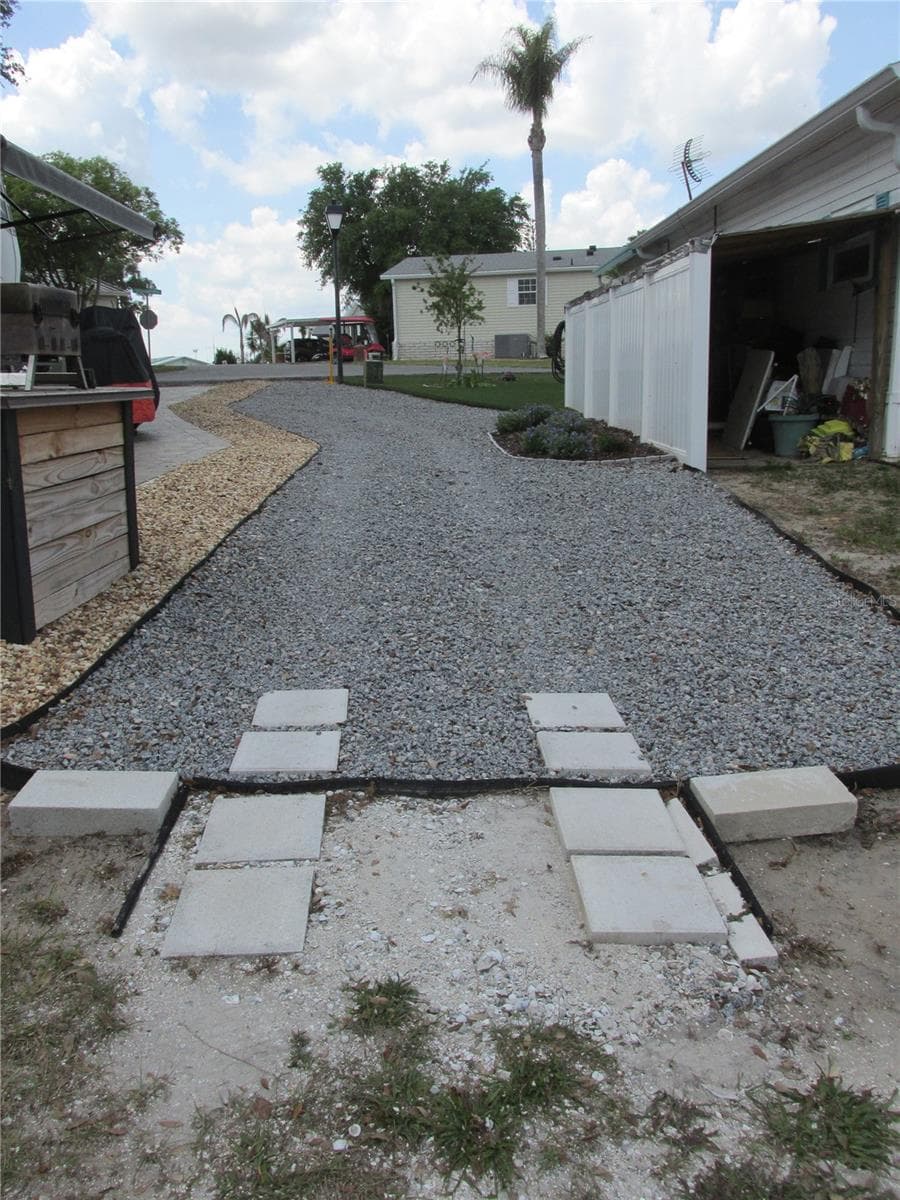 Space for parking a golf cart. - 16 SADDLEBAG TRL S, LAKE WALES