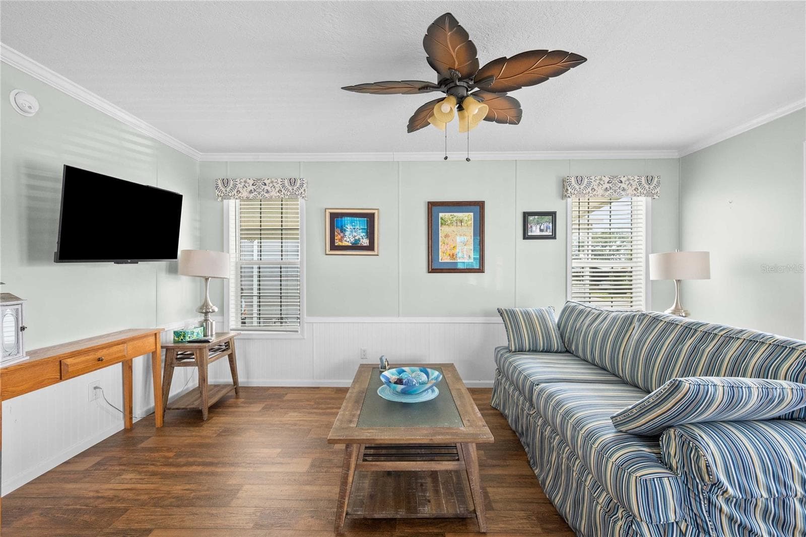 Nice living with ceiling fan and upgraded flooring. - 10042 COLLINGWOOD AVE, DADE CITY