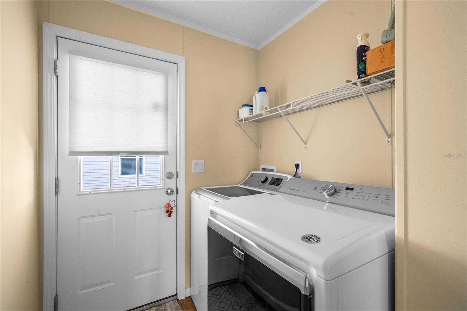 Inside laundry area. - 10042 COLLINGWOOD AVE, DADE CITY