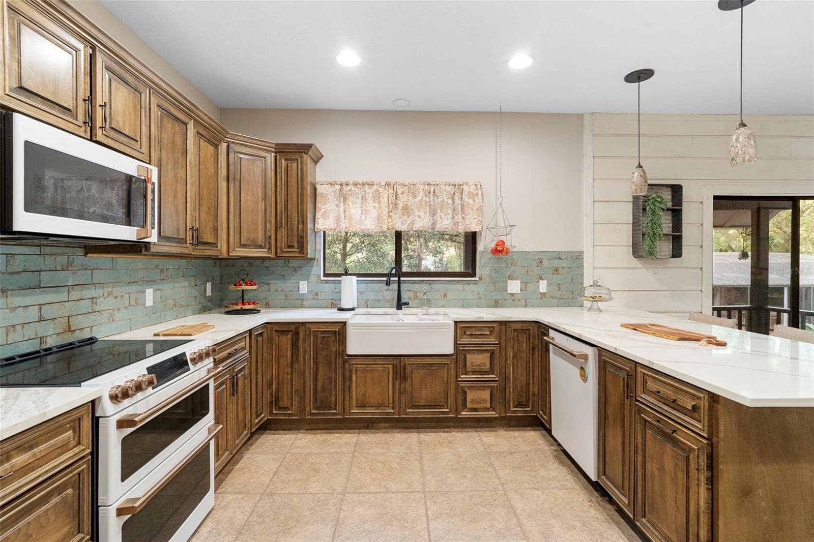 Main home Kitchen Apron Sink and GE Cafe Appliances - 1268 MCGREGOR RD, DELAND