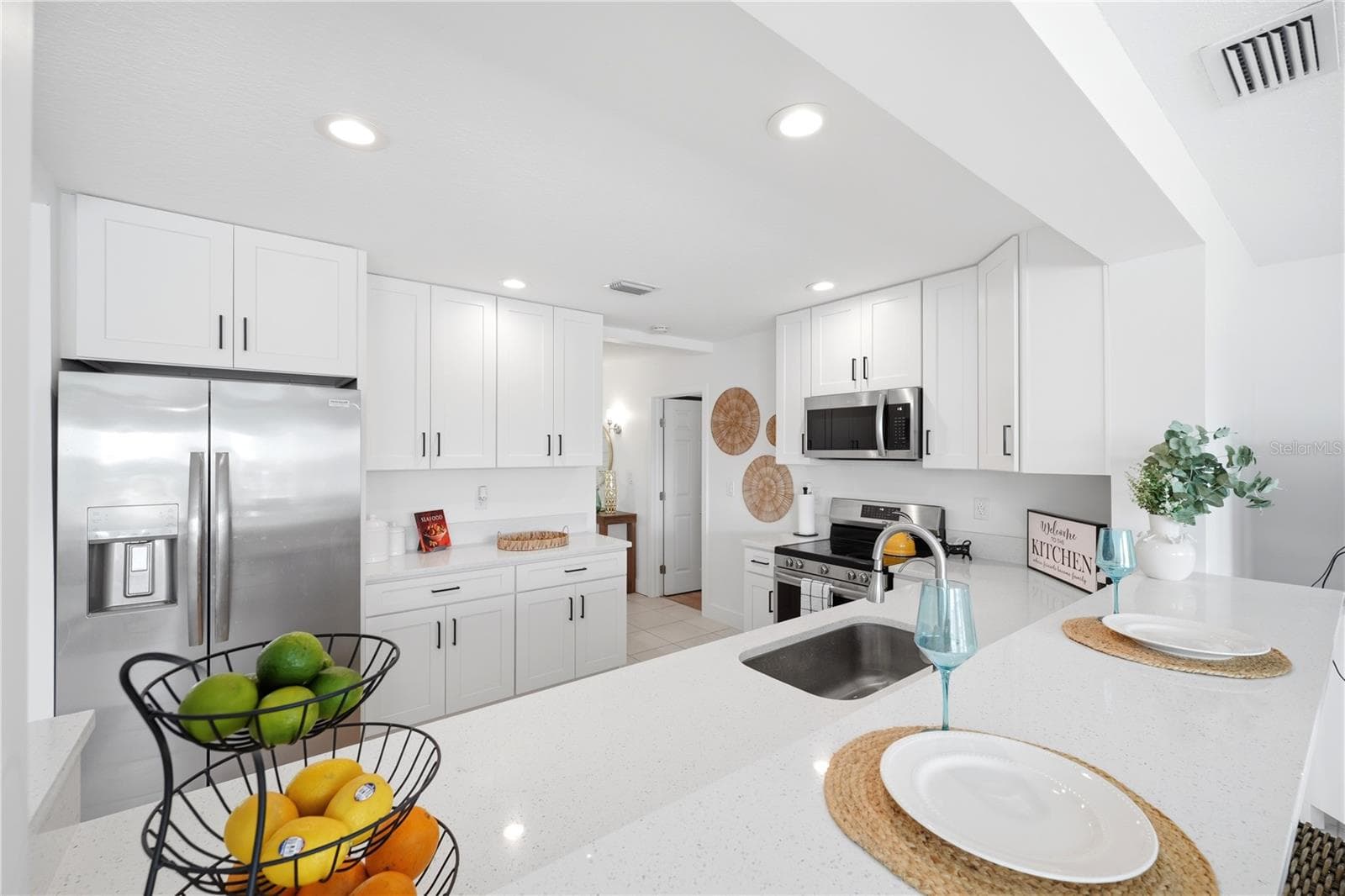 view from the family room into the kitchedn the - 5016 DORY DR, NEW PORT RICHEY