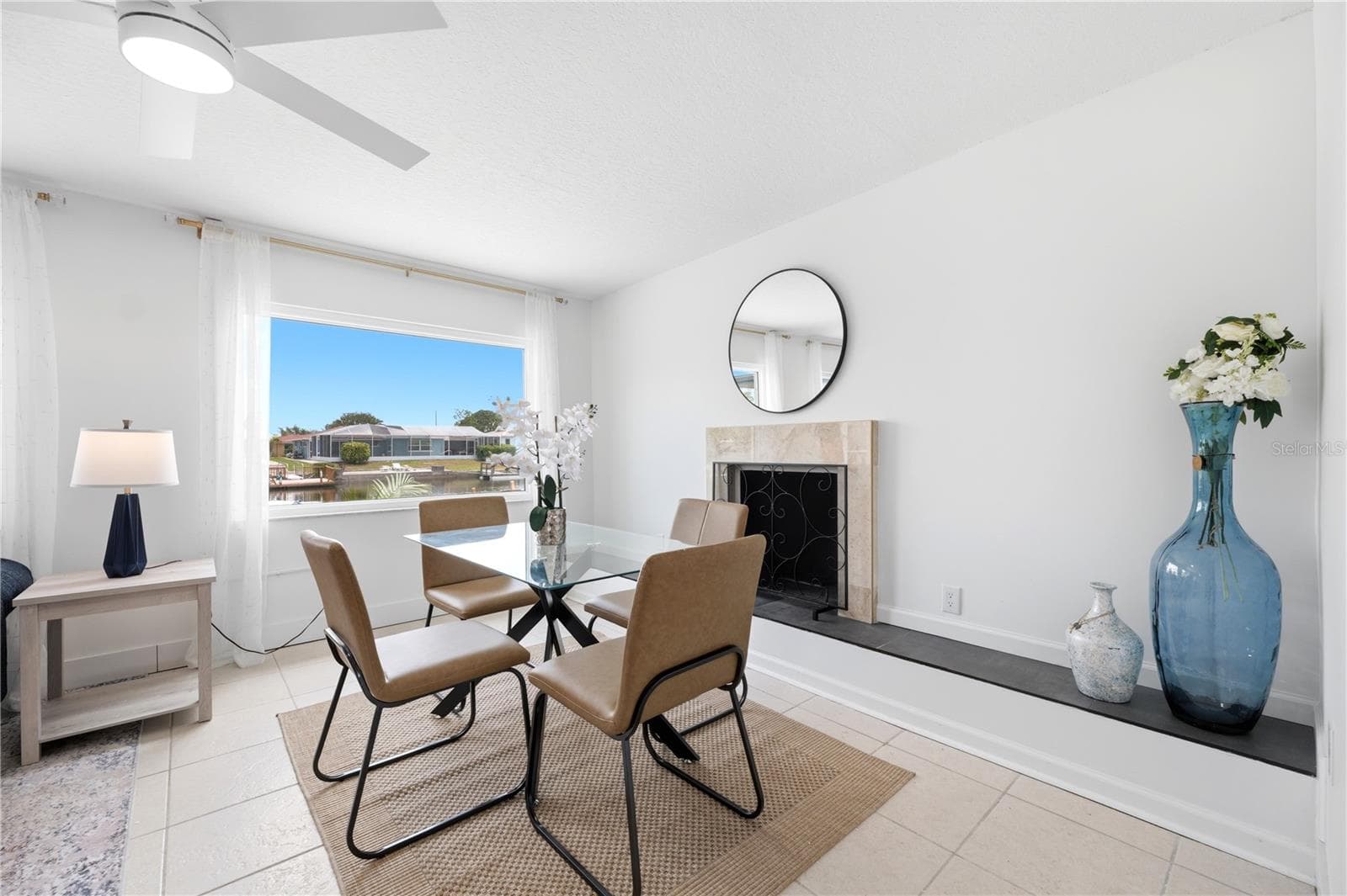 wood burning fireplace in the dining area - 5016 DORY DR, NEW PORT RICHEY
