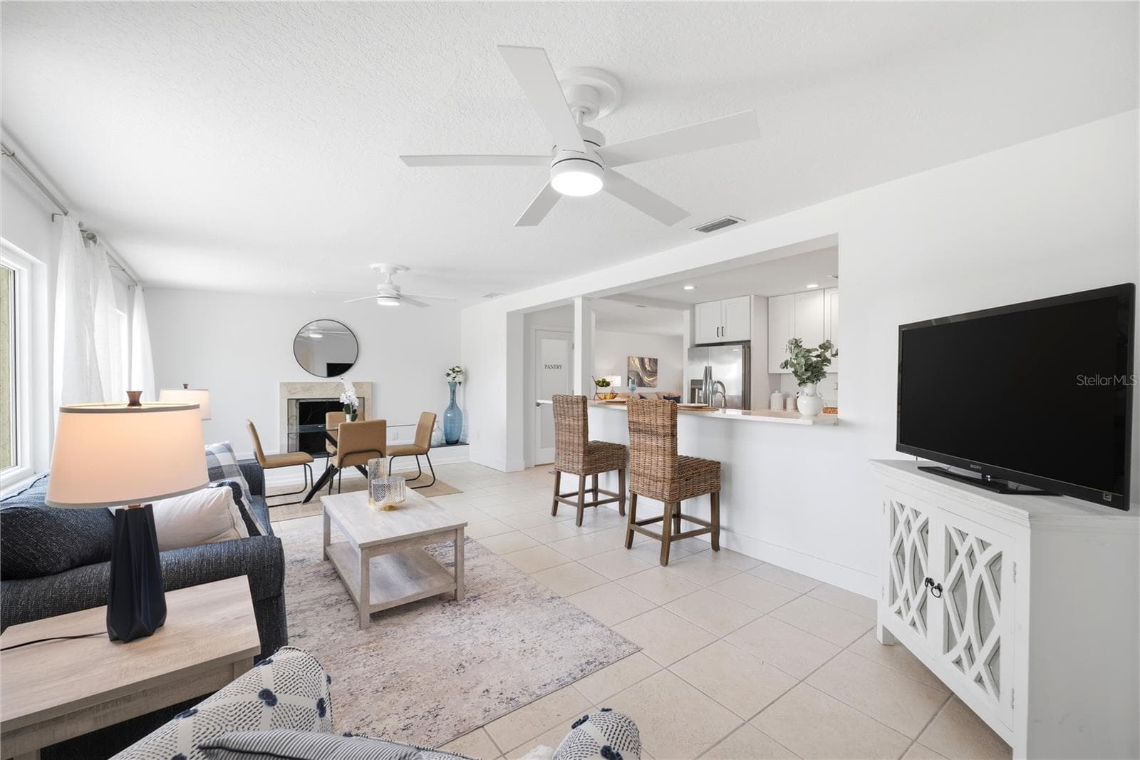 view from the back of the family room with patio sliders to the lanai - 5016 DORY DR, NEW PORT RICHEY