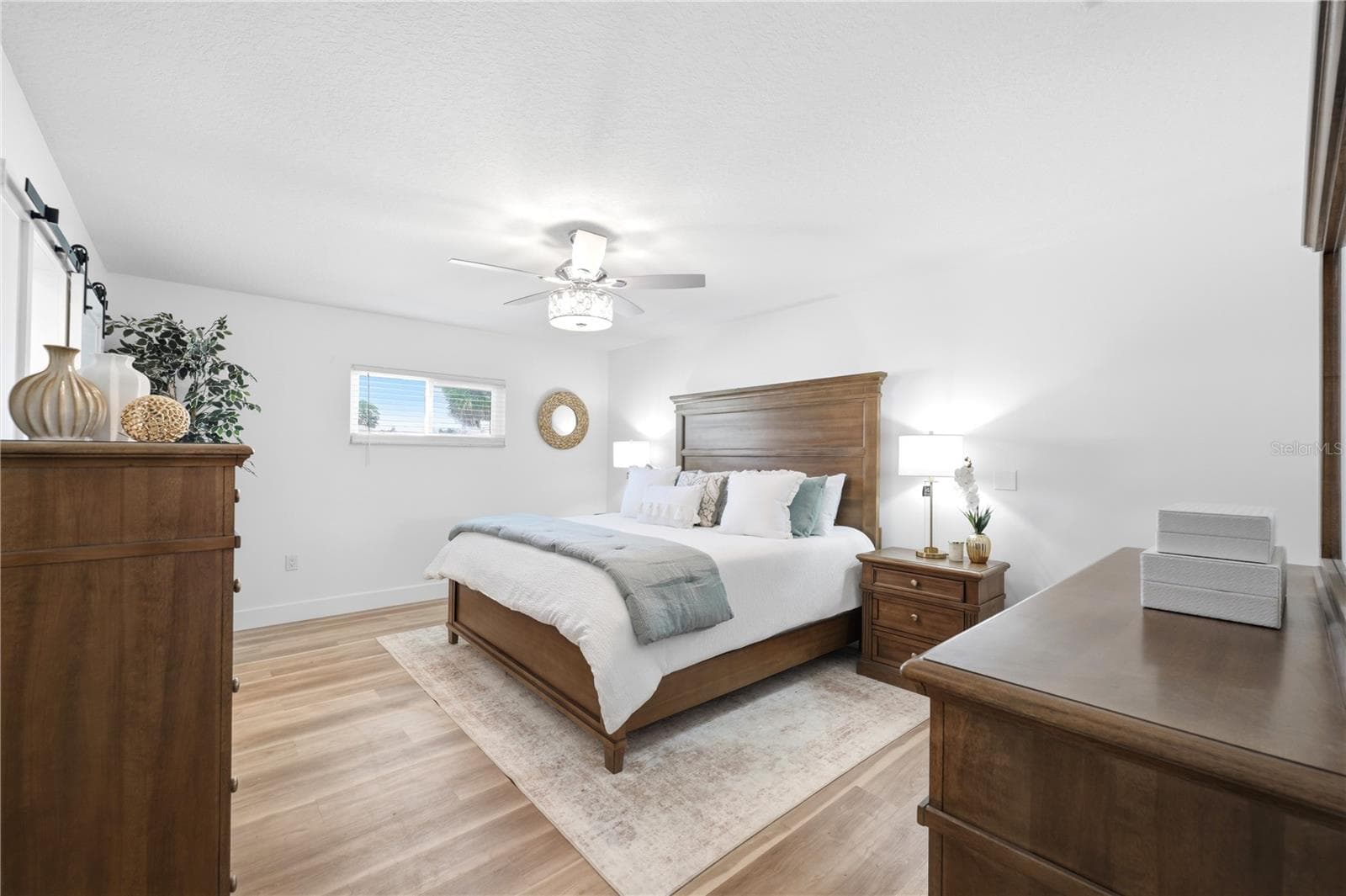 large primary retreat tastefully decorated with upgraded lighting and ensuite bathroom - 5016 DORY DR, NEW PORT RICHEY