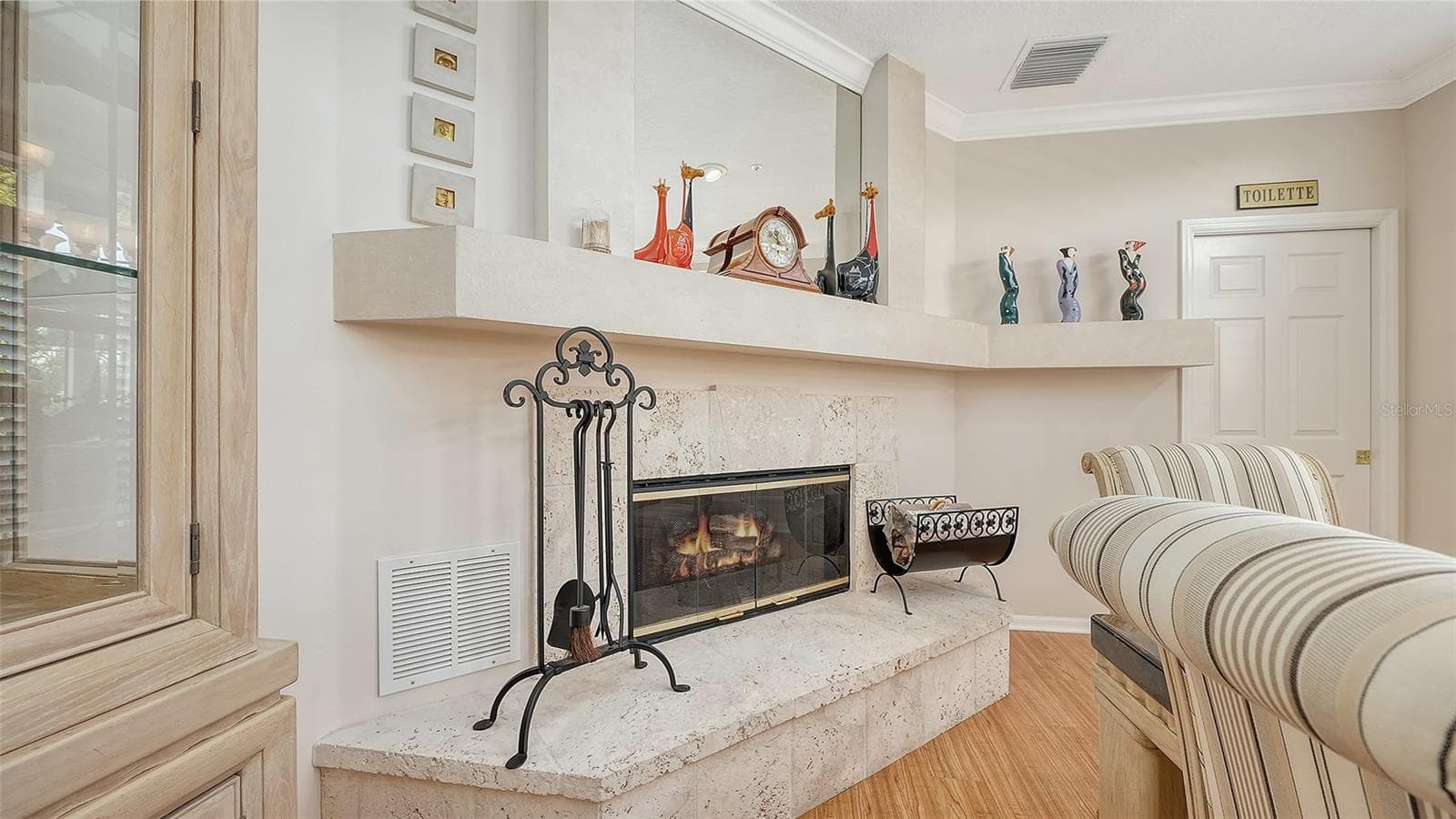 Electric fireplace graces a very spacious dining room, perfect for those dinners with family and friends. - 3040 GULF OF MEXICO DR #3, LONGBOAT KEY