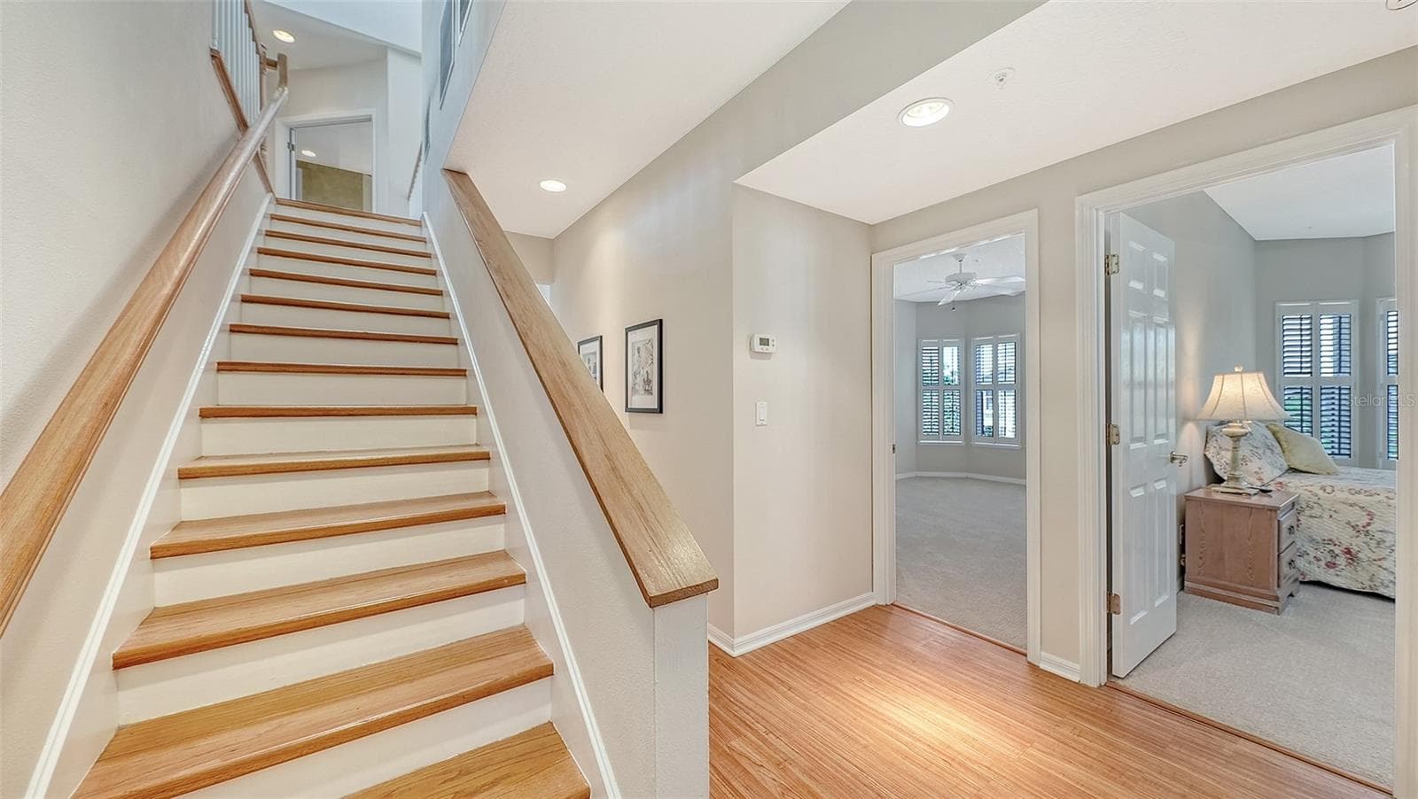 Architecturally distinct multi-level home features a stairway leading you from guest bedroom /laundry room level to the media room, 4th bedroom and primary suite. - 3040 GULF OF MEXICO DR #3, LONGBOAT KEY