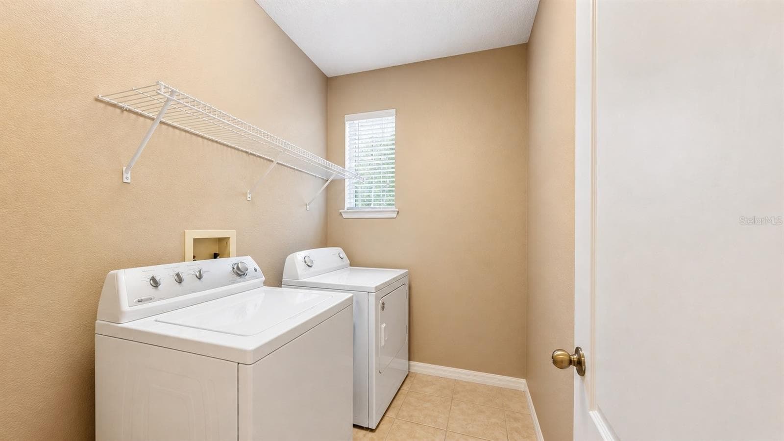 Spacious laundry room next to the garage. - 4116 ORANGE TREE CT, ST CLOUD