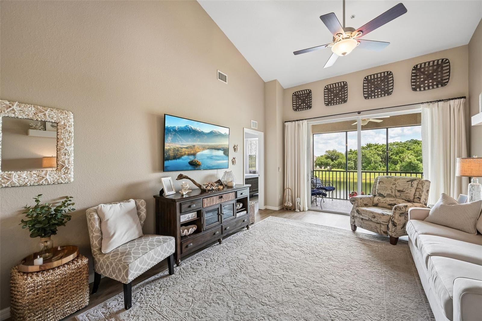 GREAT ROOM WITH BALCONY OVERLOOKING THE POND AND GOLF COURSE HOLE 16 - 1003 FAIRWAYCOVE LN #201, BRADENTON