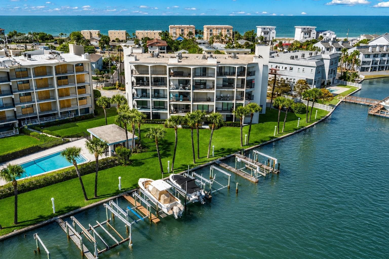 Boat slip with lift included! Located directly on the wide-open waters of the Intracoastal Waterway, right in the heart of Treasure Island and just across from the Gulf of Mexico — truly the best location on the island. - 9825 HARRELL AVE #404, TREASURE ISLAND