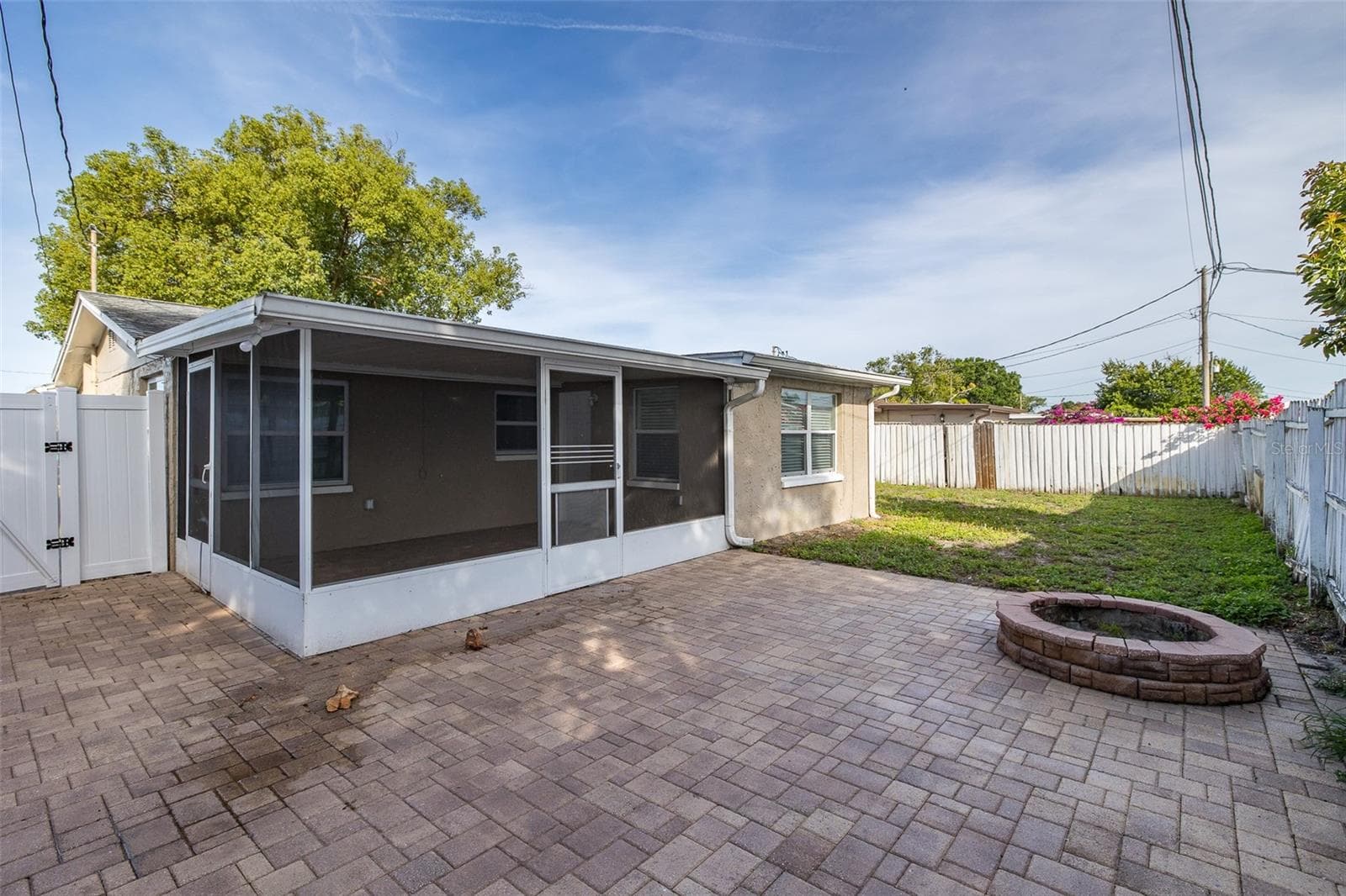 Pavers in Backyard with Firepit - 1148 FERNWOOD DR, HOLIDAY