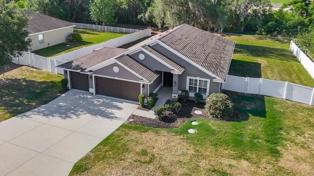 Aerial perspective showcasing the property's expansive nearly half-acre lot - 12244 LOOPBACK DR, SAN ANTONIO
