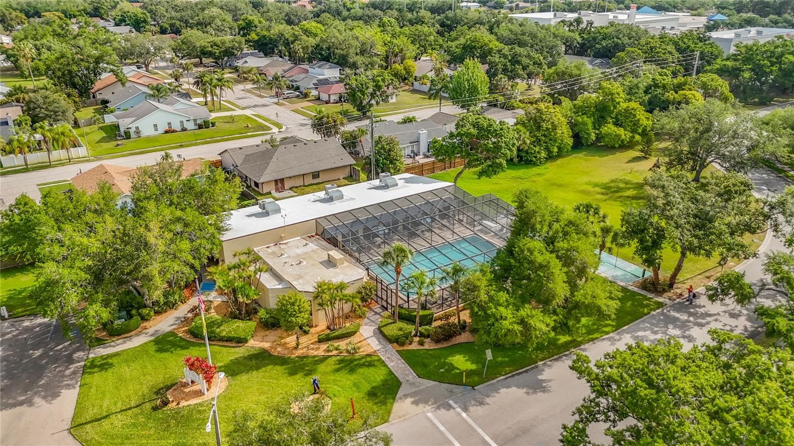 Located directly across from Building 18/3740. Woods at Pinebrook clubhouse and screen enclosed pool. - 3740 PINEBROOK CIR #607, BRADENTON