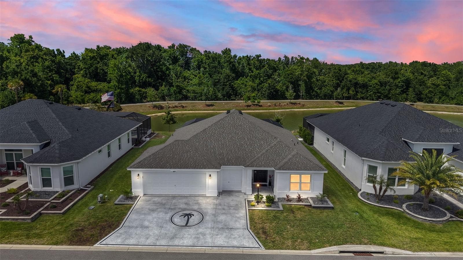 Aerial Twilight Front Elevation with Waterfront Views - 6857 BAYSINGER PATH, THE VILLAGES