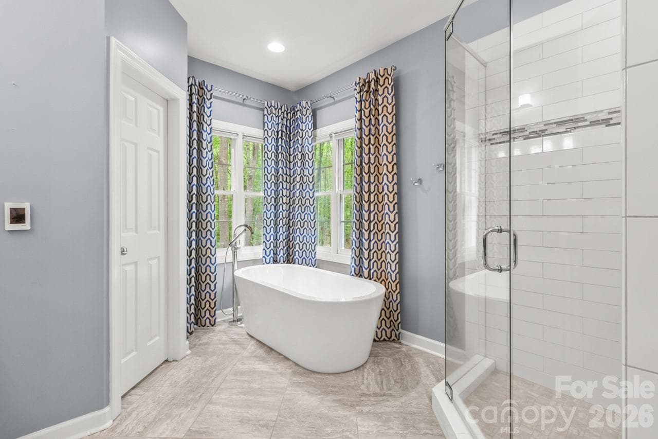 Relax in the spa-like primary bathroom soaking tub! - 4415 Everclear Court, Charlotte