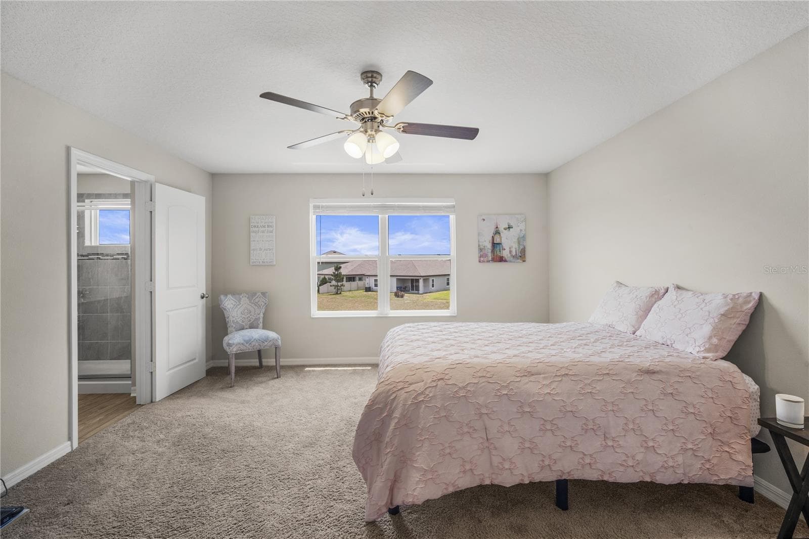 Primary bedroom is spacious with pond views! - 11240 CAY SPRUCE WAY, SAN ANTONIO
