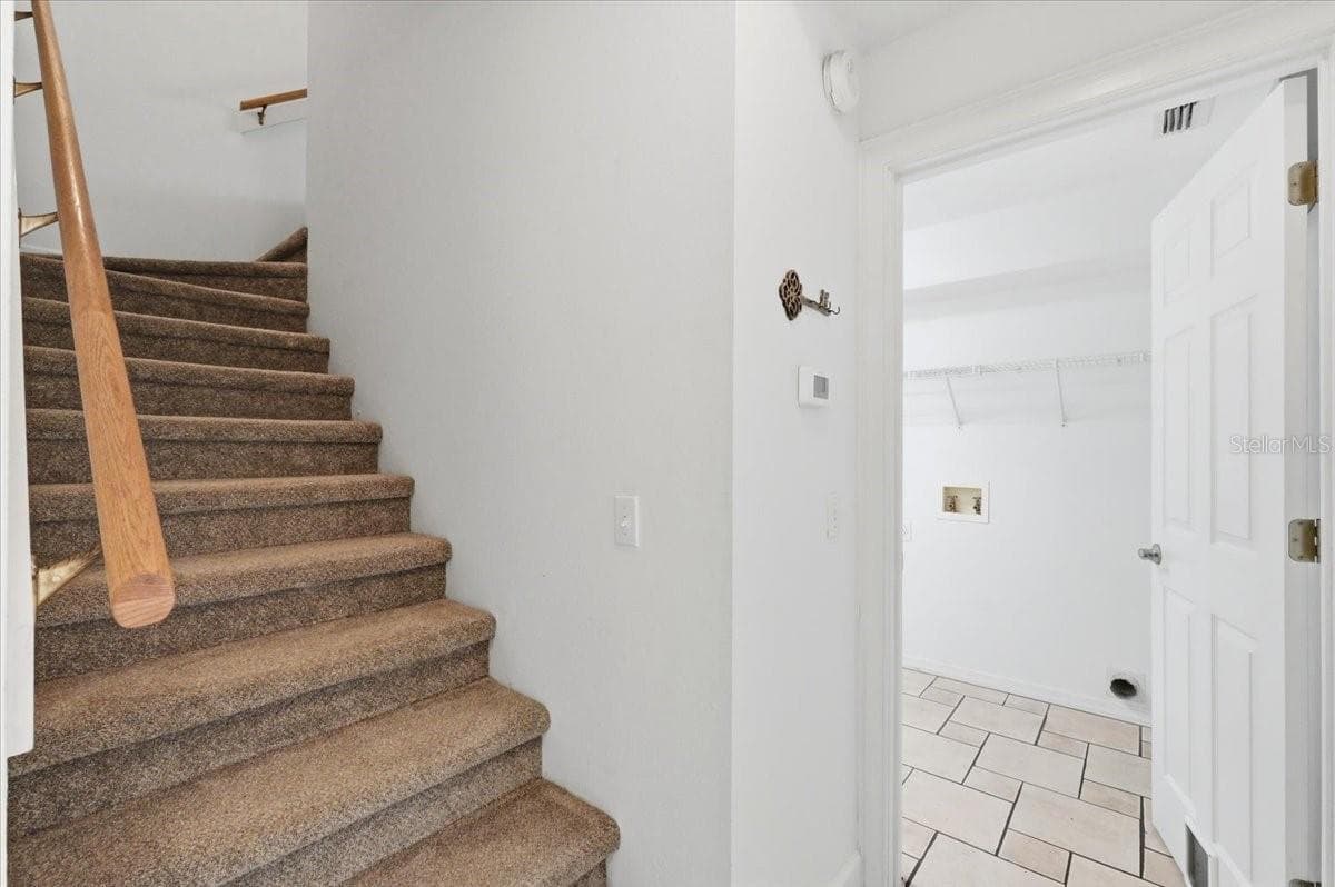 Stairs to second floor - 5628 WOODWIND HILLS DR, LAKELAND