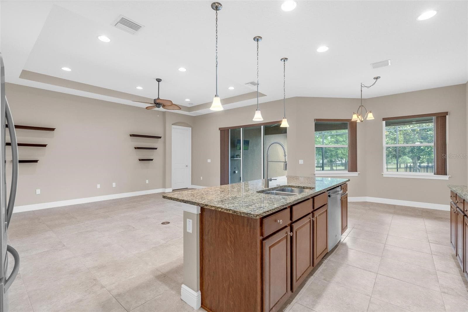 BUTLERS PANTRY WITH VIEWS OF LIVING / KITCHEN TO BACKYARD - 903 VICTORIA HILLS DR S, DELAND