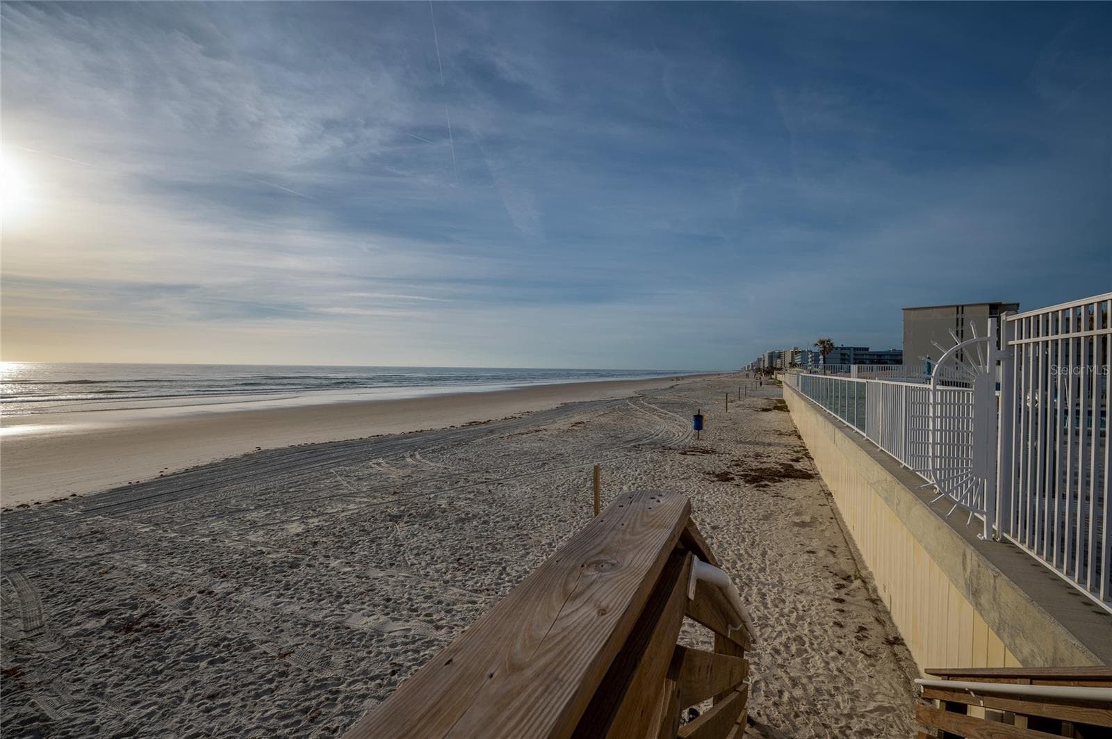 Panoramic view of the shoreline where the golden sands meet the blue waters. - 935 S ATLANTIC AVE #165, DAYTONA BEACH