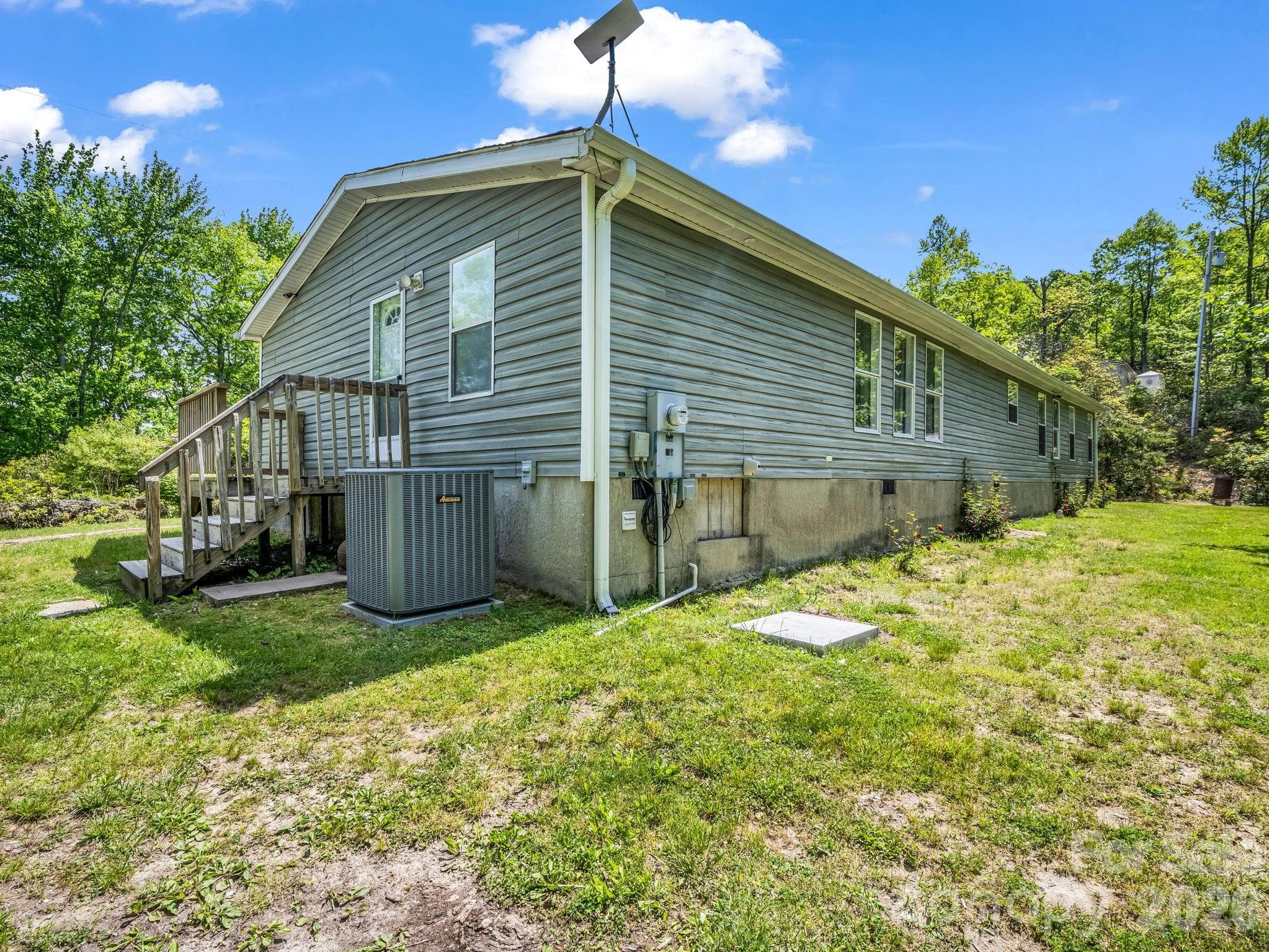 Side entrance and back, generator pad and hookup - 2053 Nancy Mountain Road, Rosman