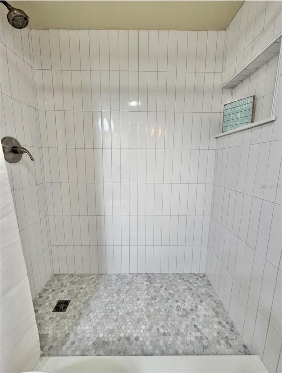 The brand new walk-in shower was professionally built, and it has new fixtures and a niche too! - 3815 N OAK DR #G71, TAMPA