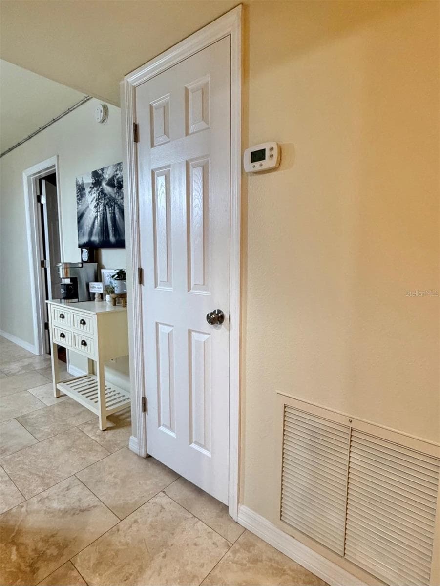 Just outside the kitchen are two closets/pantries. There's another closet on the left. - 3815 N OAK DR #G71, TAMPA