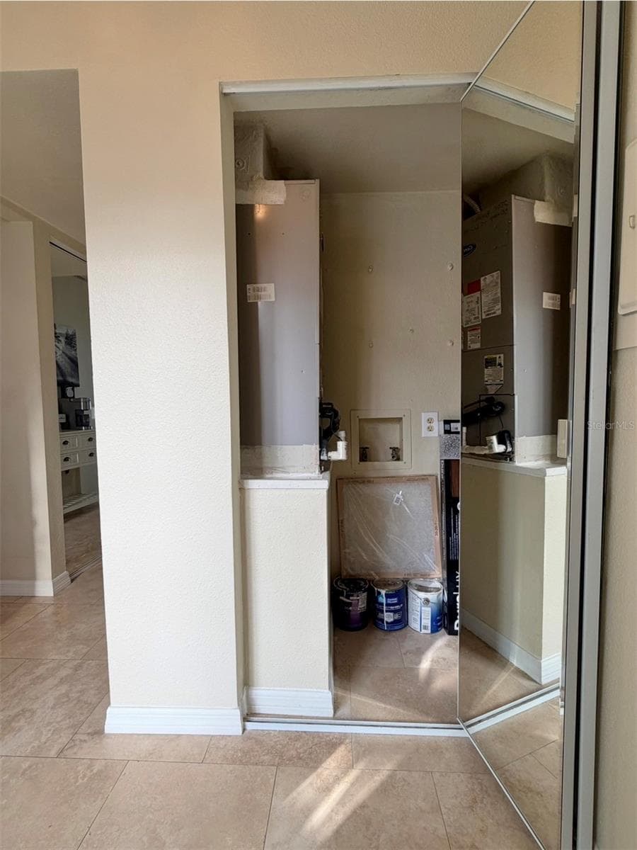 Air handler and BRAND NEW hot water heater closet, has storage space too. - 3815 N OAK DR #G71, TAMPA