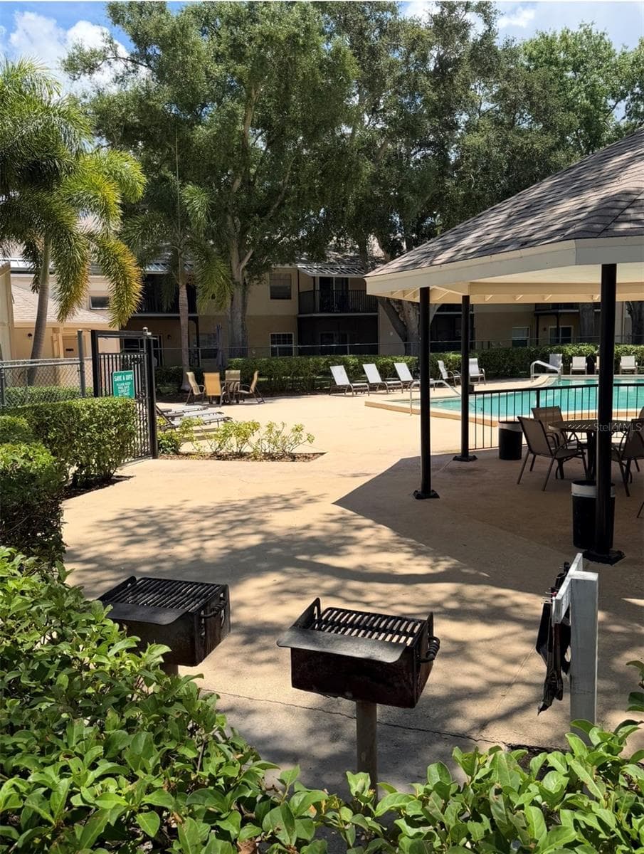 Grilling areas are for residents to use, and BBQ tools are included if needed. - 3815 N OAK DR #G71, TAMPA