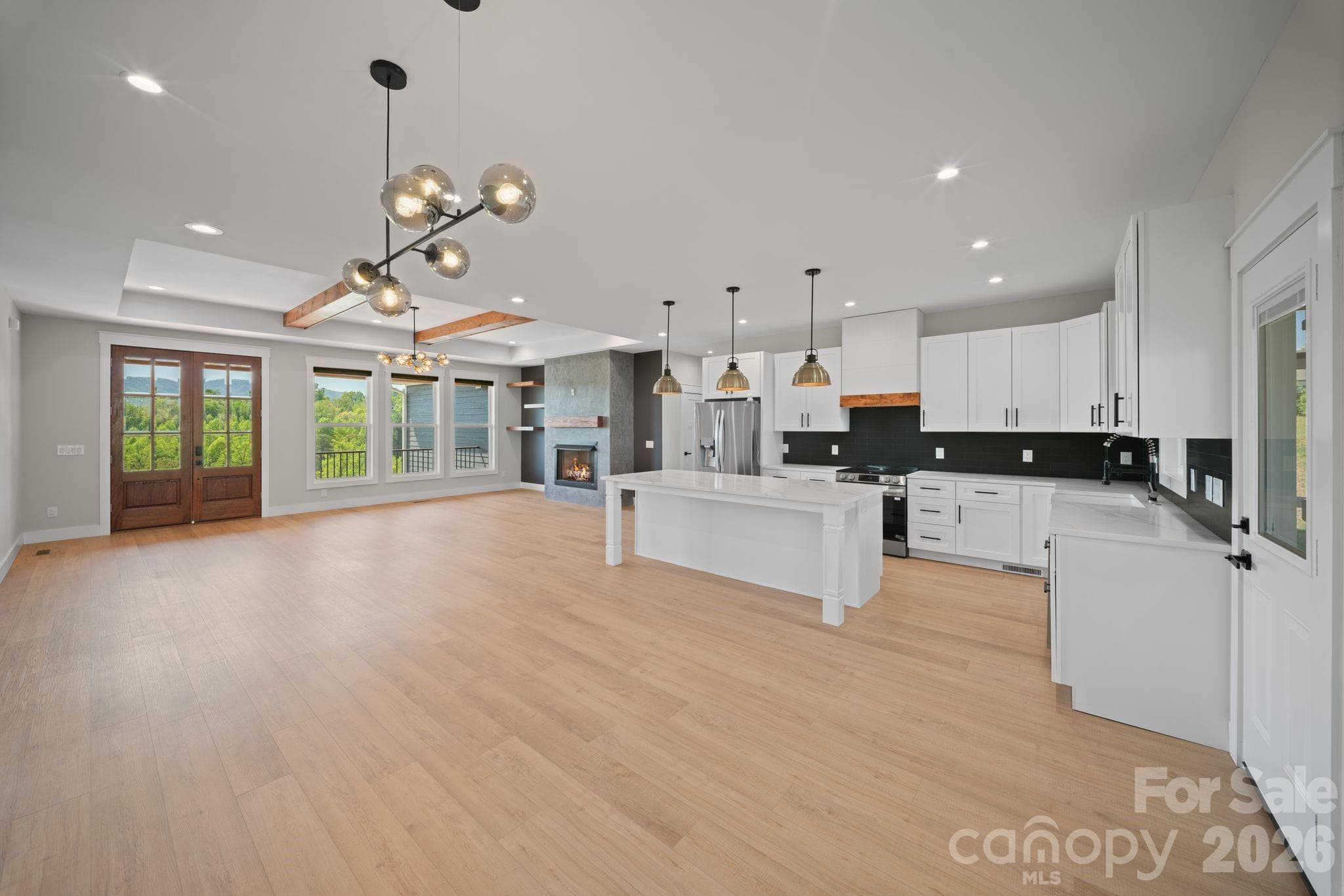views from the dining area into the kitchen and living room - 111 Pisgah Gap Drive, Candler