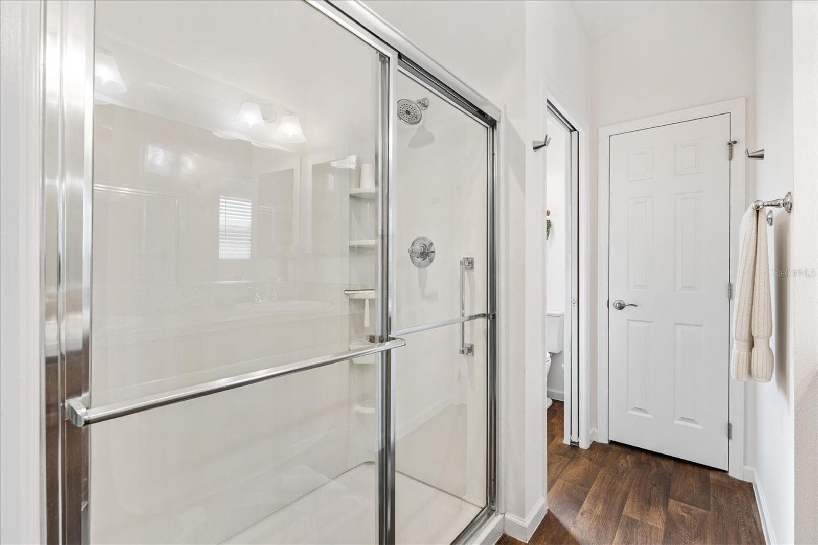 Primary Bathroom shower with glass door and separate area for toilet - 1773 BLACKWELL LN, THE VILLAGES