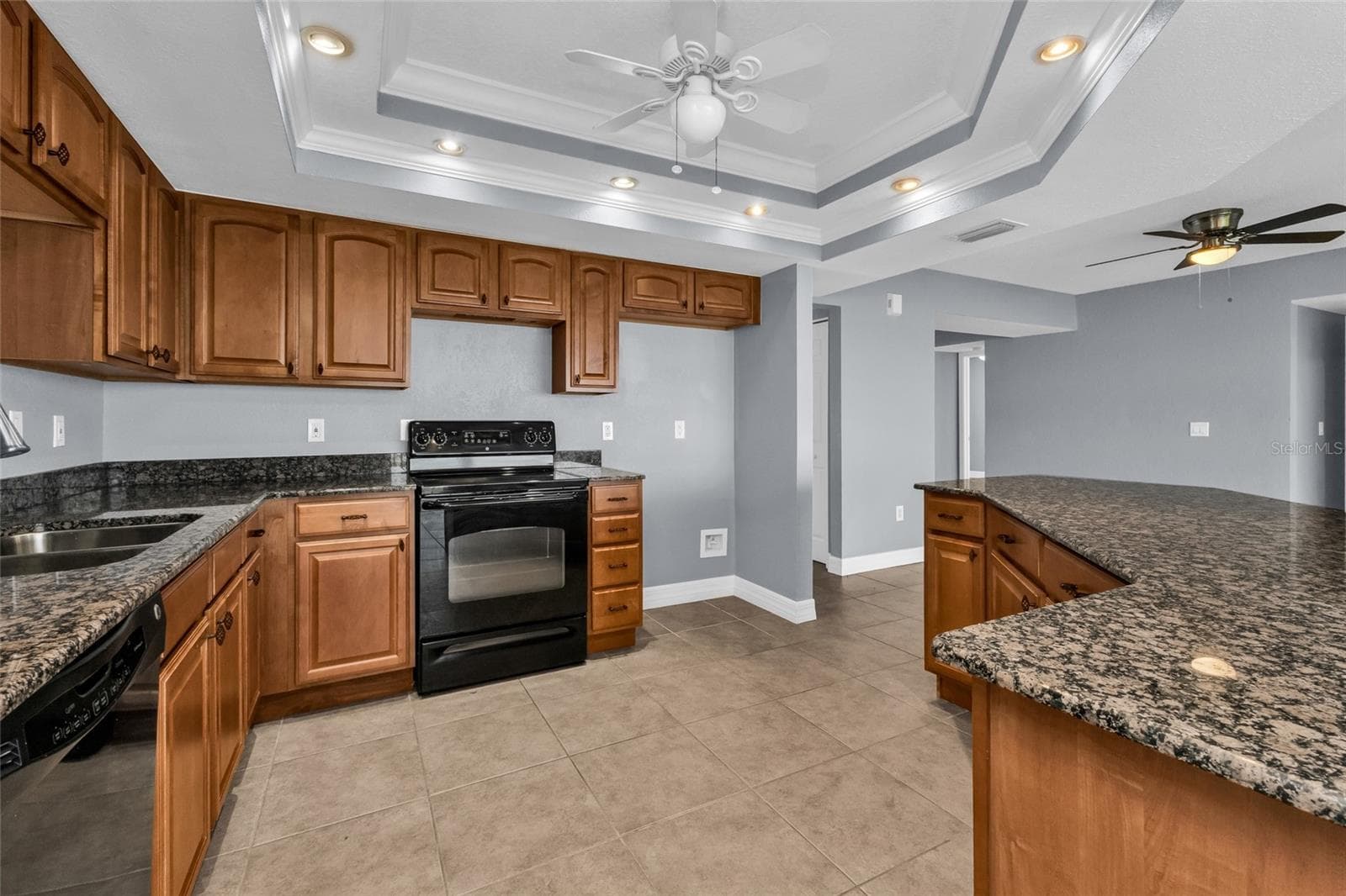 Kitchen from dining room - 101 N MARION CT #213, PUNTA GORDA