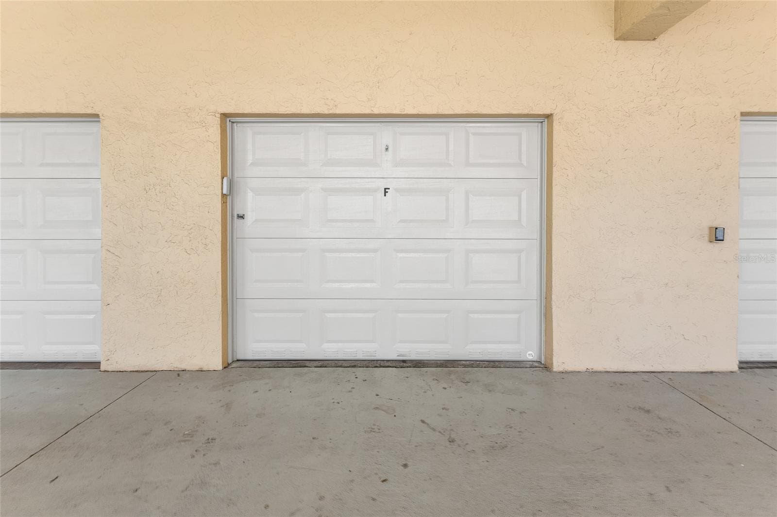 Garage F. 12' 3" wide and 20' 0" deep with storage platform - 101 N MARION CT #213, PUNTA GORDA