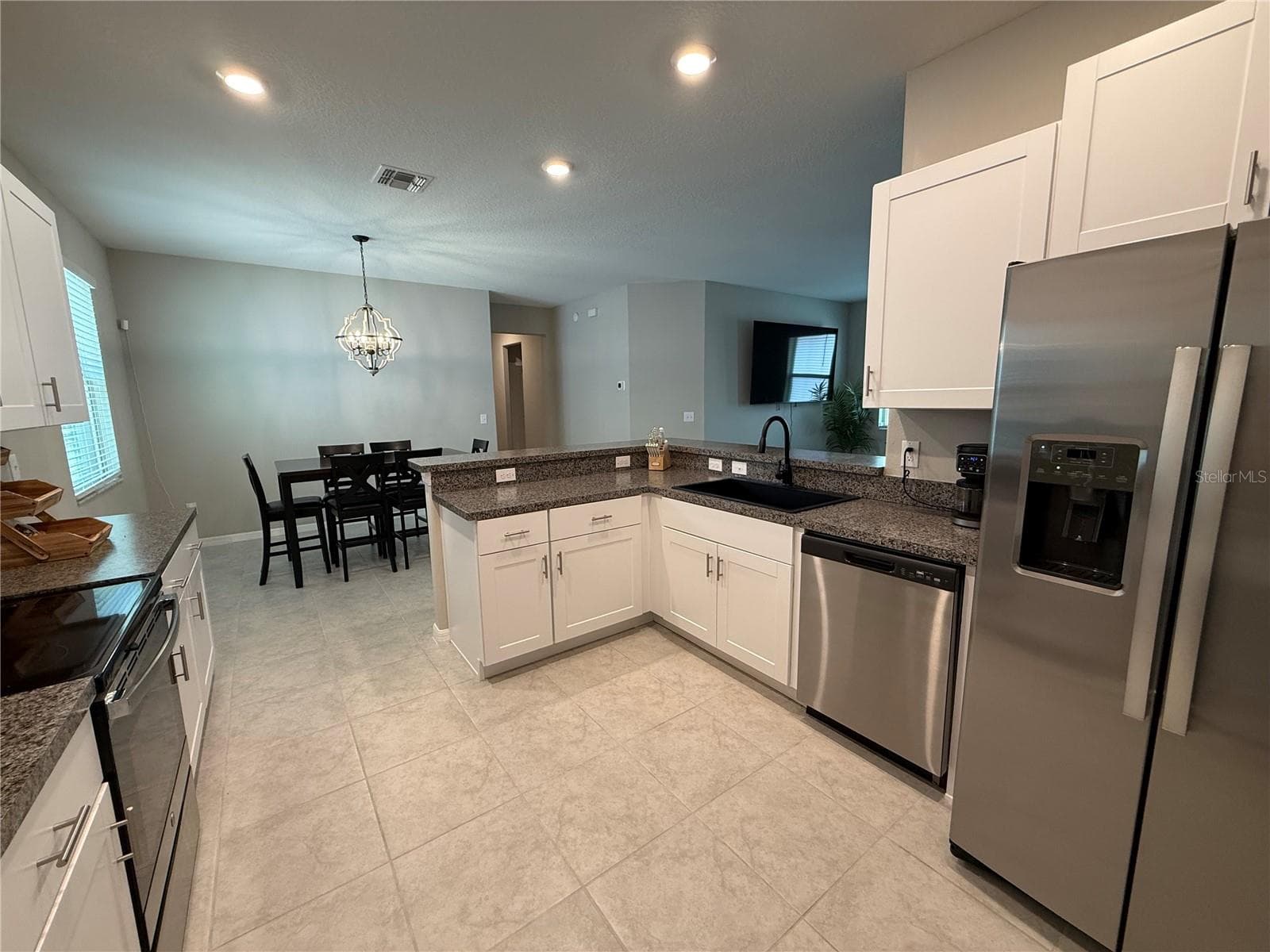 Stainless Steel appliances compliment the kitchen - 9601 FLOURISH DR, LAND O LAKES