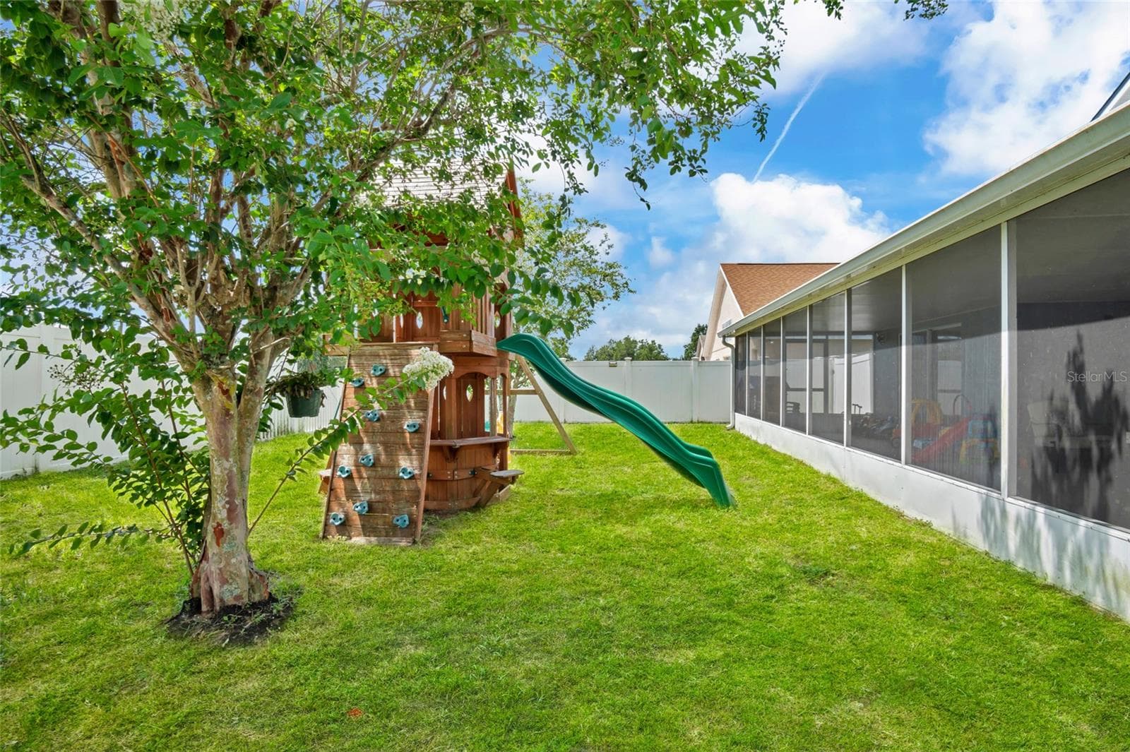 Backyard angle with playset - 8335 ADELE RD, LAKELAND