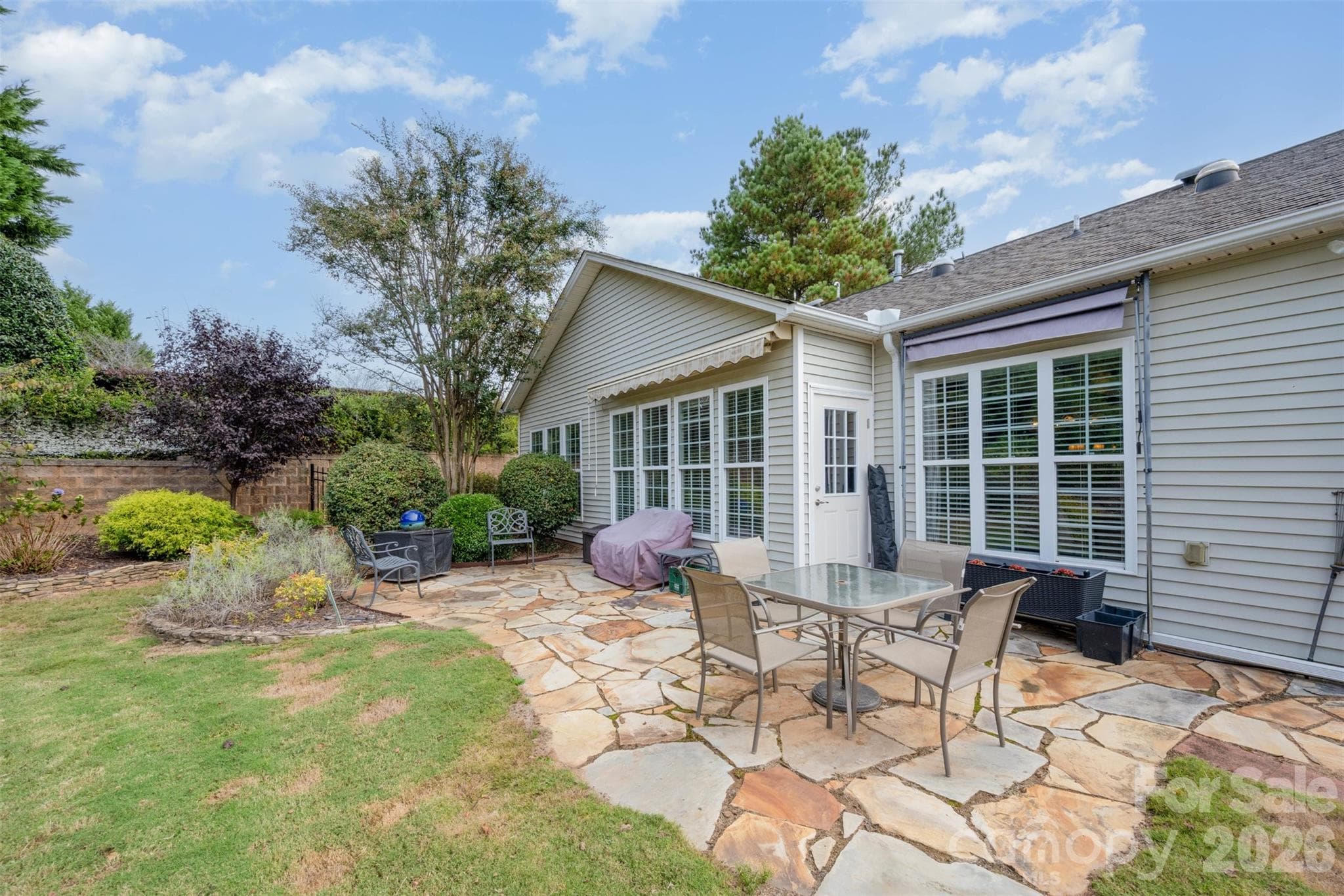 Beautiful stone patio with awnings. - 43041 Mimosa Court, Fort Mill