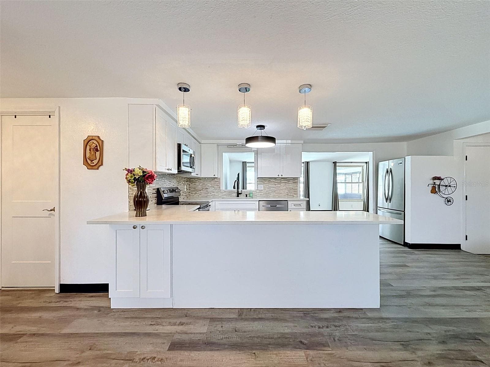 Lovely lighting adds warmth and coastal charm. - 12735 1ST ISLE, HUDSON