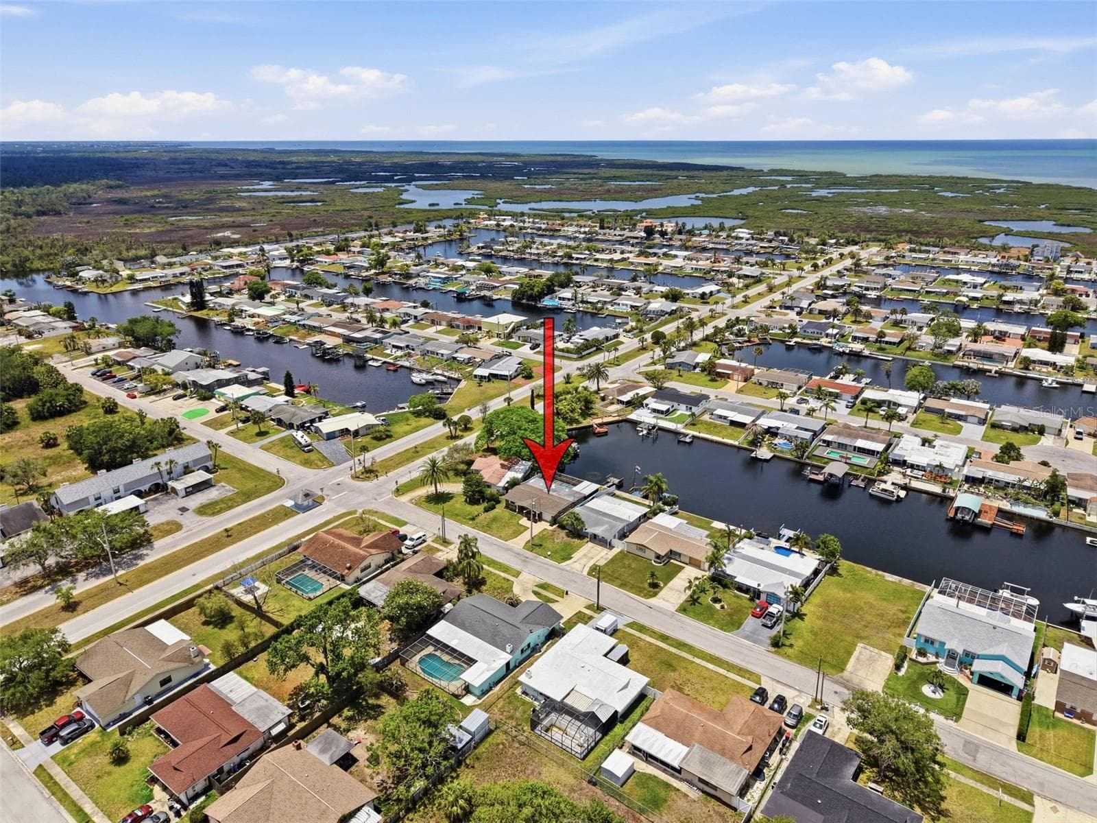 Arrow indicates the home’s location within the waterfront community. - 12735 1ST ISLE, HUDSON