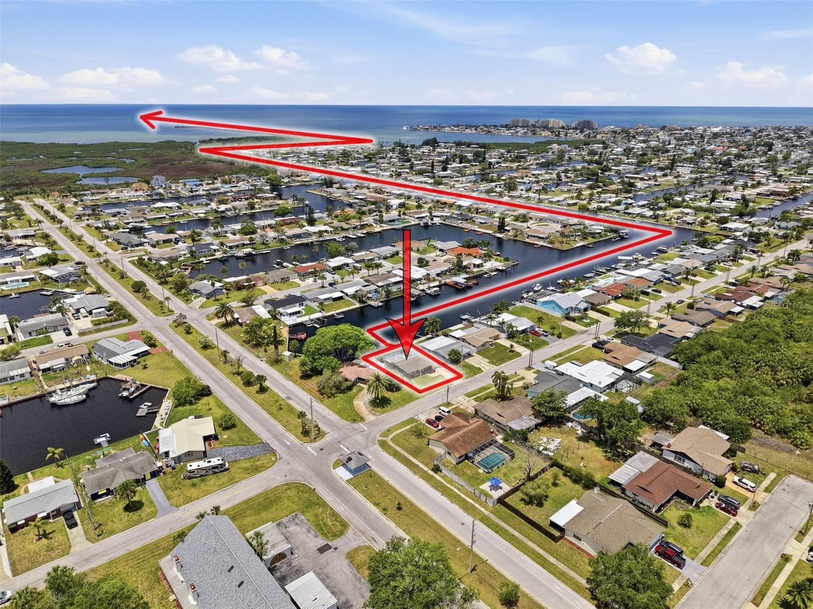 Aerial view highlights the direct Gulf access route from the property. - 12735 1ST ISLE, HUDSON